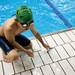 A young swimmer climbs out of a lap pool at Canham Natatorium on Monday, July 29. Daniel Brenner I AnnArbor.com